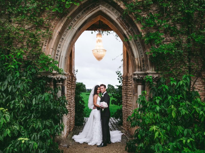 Romantic wedding couple in meadow at Euridge Manor