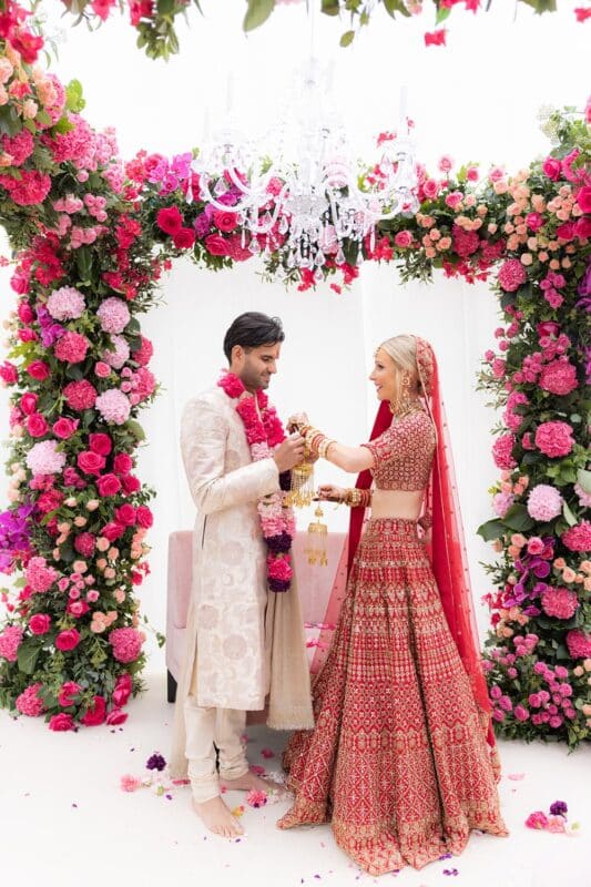 Chelcie and Arjun in traditional attire during Indian wedding ceremony in Scotland