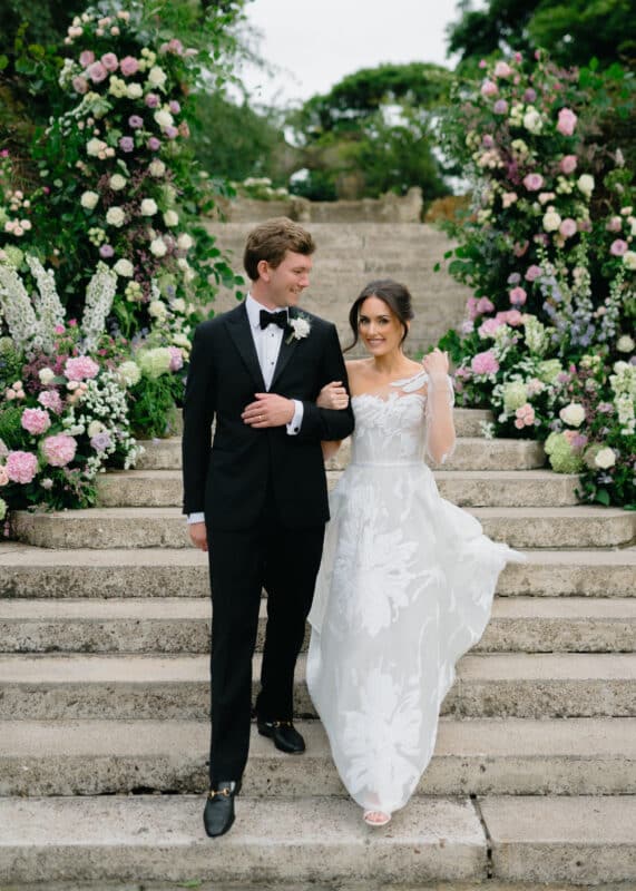 Bride and groom exchange vows during a garden ceremony at a private estate in North Berwick, Scotland. 