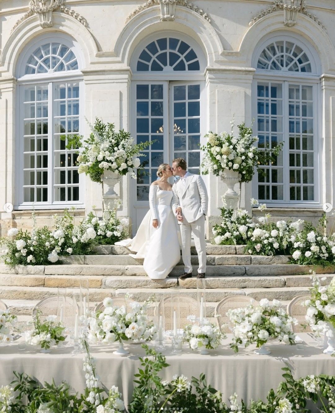 Bride Genevieve and groom Jack walking together through the formal gardens of Château du Grand-Lucé — timeless white wedding in the Loire Valley, France — HD Moments